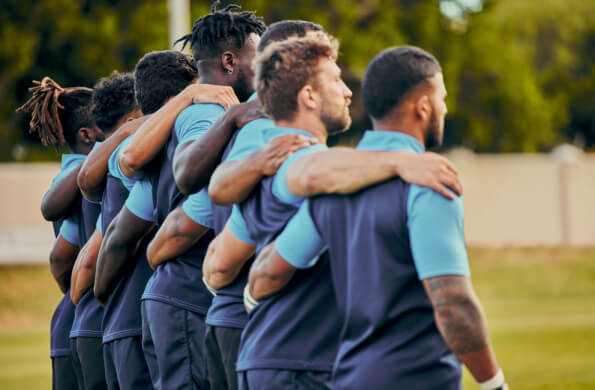 A men's sports team embracing