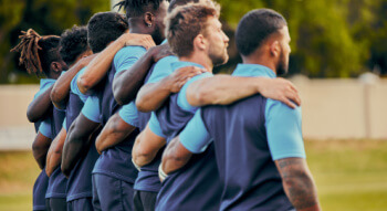 a mens sports team embracing