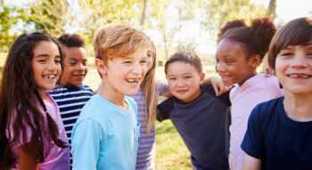 a group of students smiling and hugging