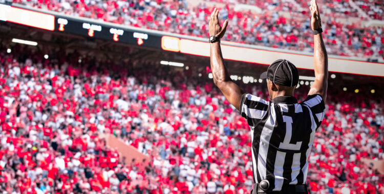 A referee making a call at a football team